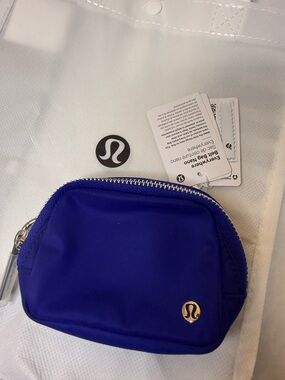 lululemon athletica Small Zip Pouch in Royal Purple with Gold Logo